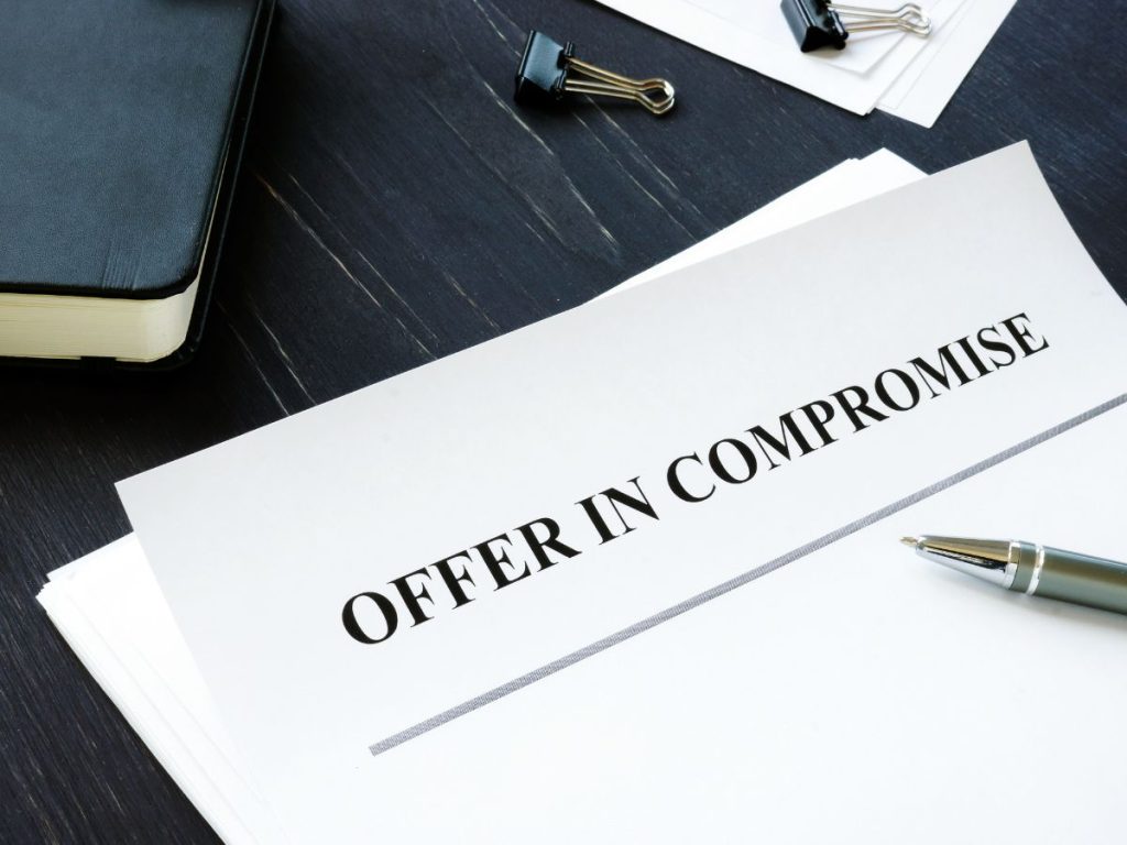 A page lying on a desktop, saying 