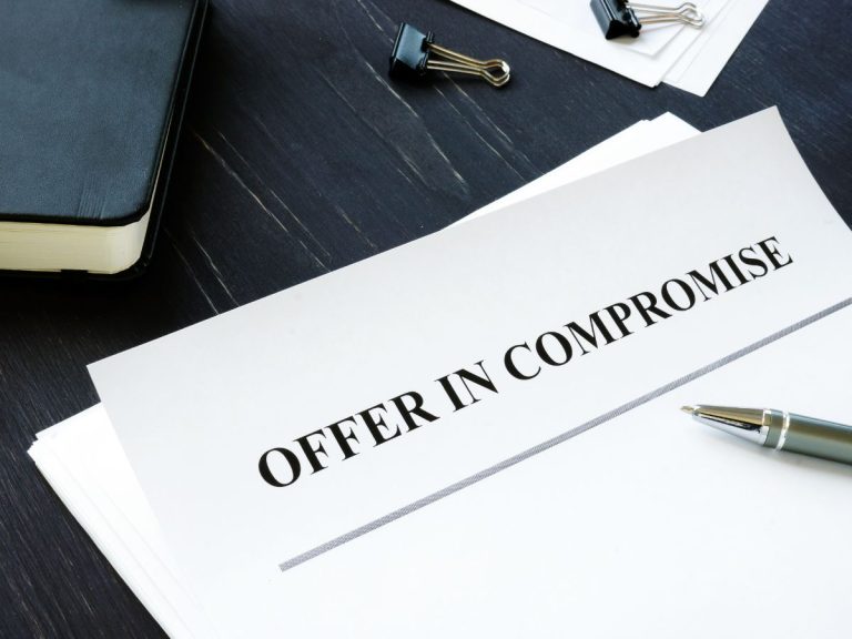 A page lying on a desktop, saying 